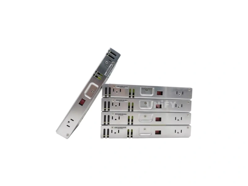 Four Mean Well LRS-200 switching power supplies stacked with one standing upright showing mounting flanges