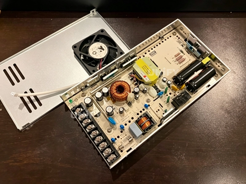 Mean Well LRS-350 power supply opened teardown showing internal DC fan PCB choke and capacitors
