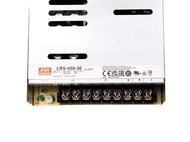 Mean Well LRS-450-24 label and terminal closeup showing UKCA CE EAC marks IS 13252 registration and ADJ potentiometer